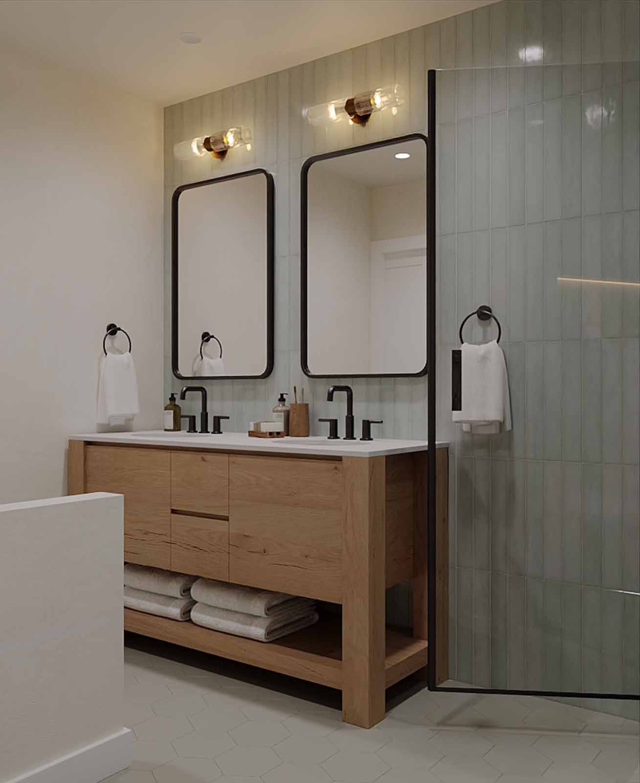 Modern double vanity bathroom with sage green tile, oak wood vanity, and matte black fixtures