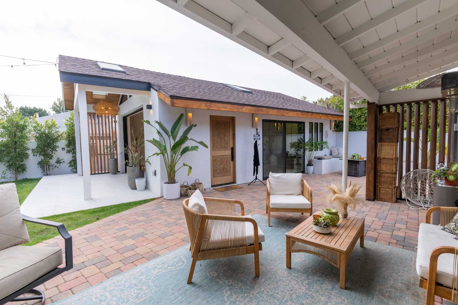 Glendale accessory dwelling unit with beautiful stone patio, outdoor seating area, and lush garden landscaping