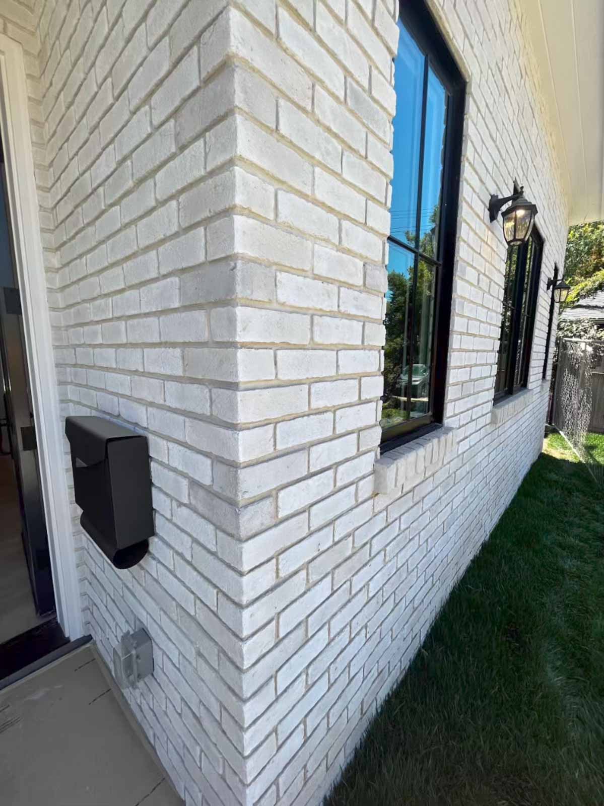 Room addition brick detail Pasadena showing quality masonry work and modern windows - LA home expansion