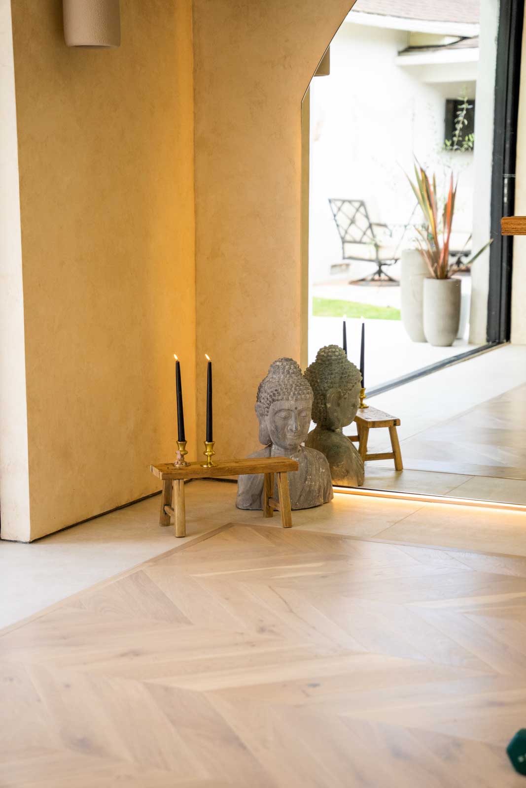Peaceful meditation corner in Santa Clarita ADU with yoga mat, plants, and natural light from large windows
