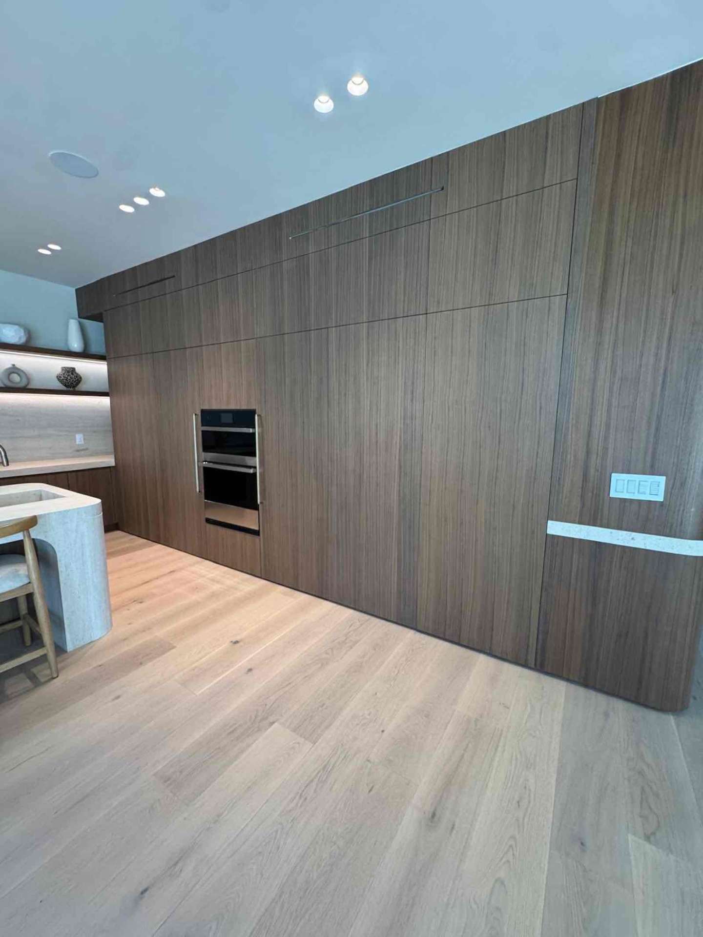 Encino kitchen floor-to-ceiling walnut wall unit with built-in ovens